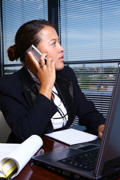 Happy business woman in the office