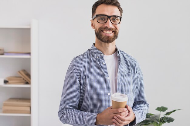 Happy businessman in office