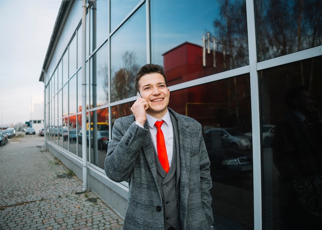 Free photo happy businessman walking