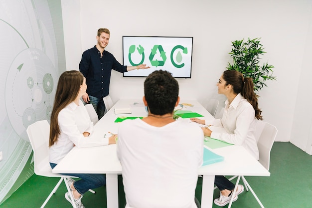 Happy businesswoman giving presentation on natural resources to his colleagues