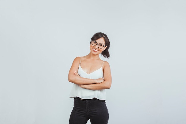 Happy businesswoman posing with crossed arms