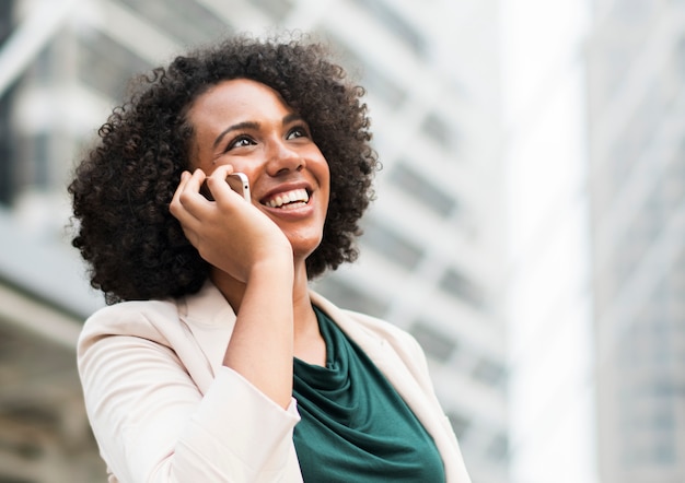 Happy businesswoman talking on the phone