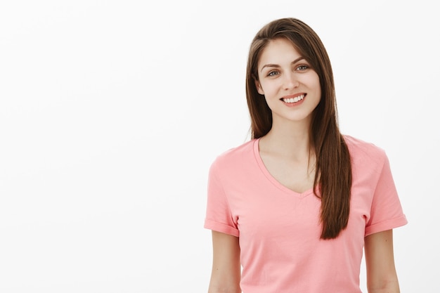 happy carefree brunette woman posing in the studio