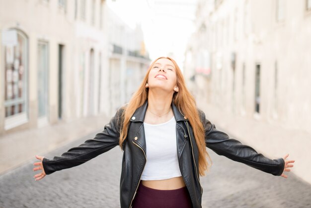 Happy carefree girl enjoying city stroll