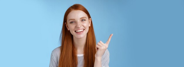 Happy charismatic redhead laughing young girl having fun looking carefree talking discussing new pro