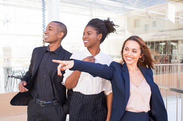 Happy cheerful business people overjoyed with scene