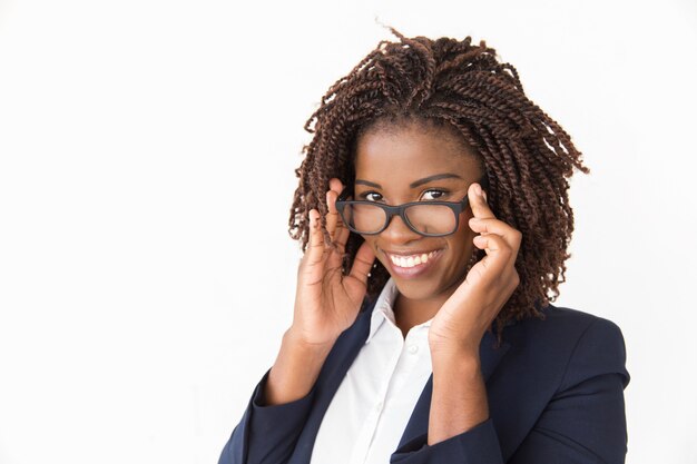 Happy cheerful customer trying on glasses