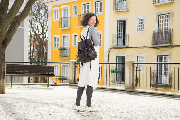 Free photo happy cheerful female traveler ready for walk