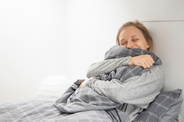 Free photo happy cheerful girl getting enough sleep