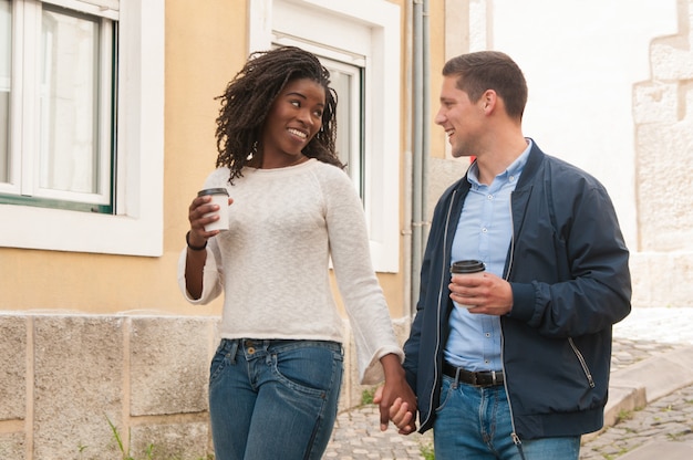 Happy cheerful interracial couple enjoying date