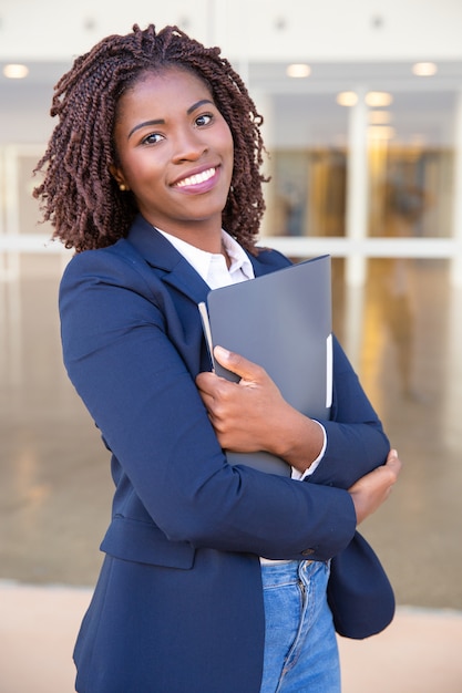 Free photo happy cheerful office employee posing outside