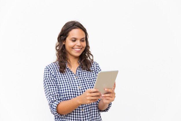 Happy cheerful woman using tablet