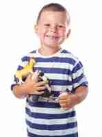 Free photo happy child with dinosaur toys