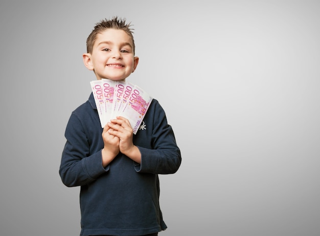 Happy child with money