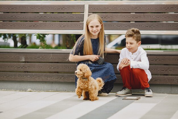 Happy children sitting together close and smile