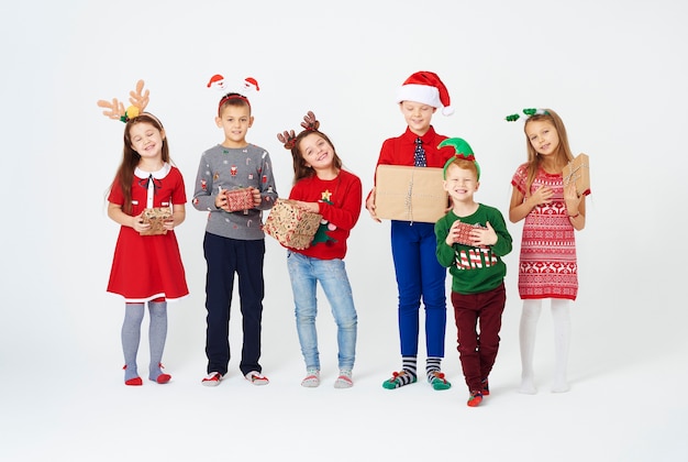 Free photo happy children with christmas gifts