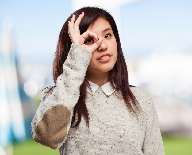 happy chinese-woman binoculars sign