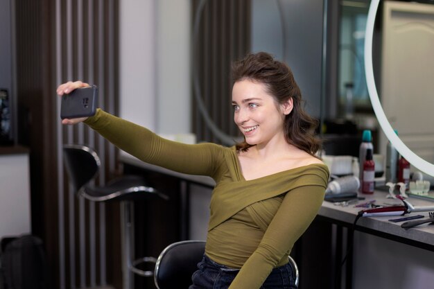 Happy client in hairdresser shop