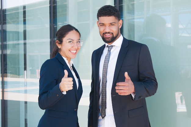 Free photo happy confident business partners enjoying teamwork