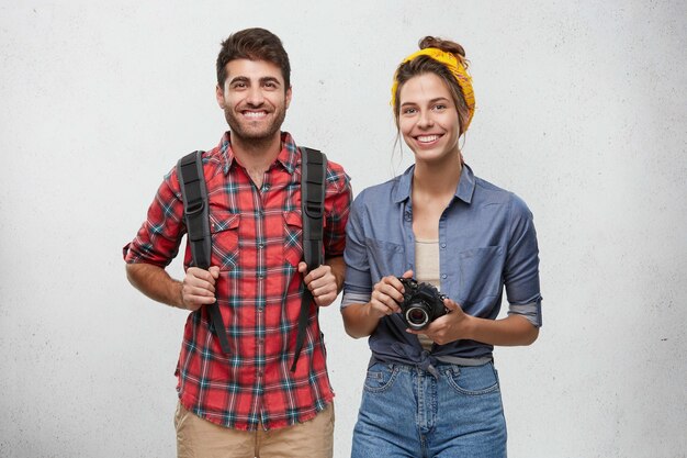 Happy couple dressed casually posing