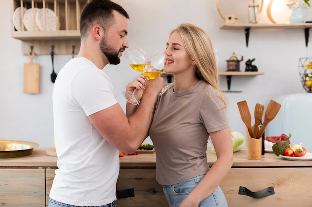 Happy couple drinking from glasses