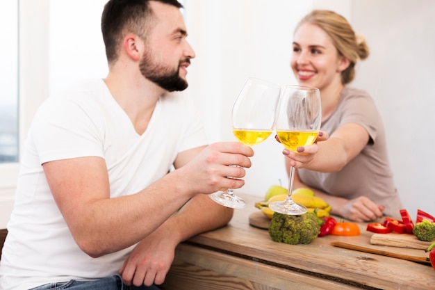 Free photo happy couple eating vegetables and drinking together
