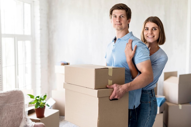 Happy couple embraced on moving out day