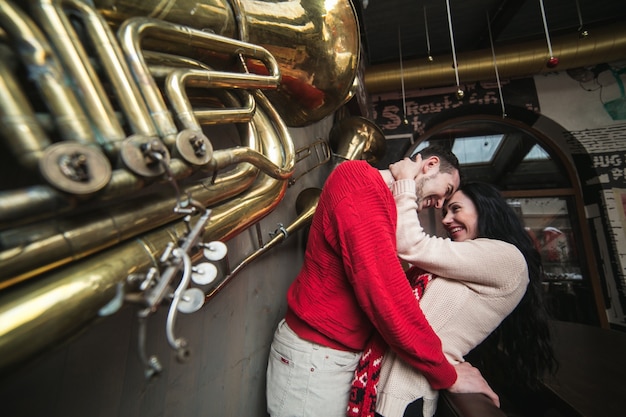 "Happy couple embracing on street"