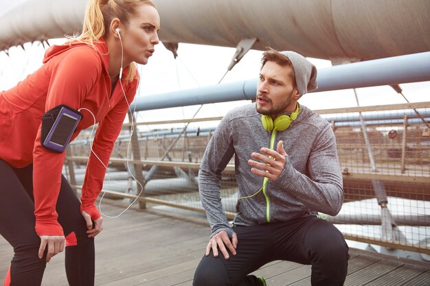 Happy couple exercising outdoors