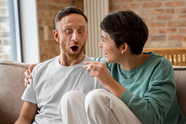 Happy couple finding out they're going to be parents based on pregnancy test