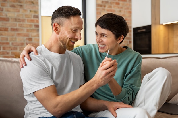 Happy couple finding out they're going to be parents based on pregnancy test