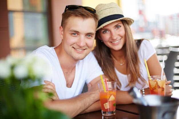 Happy couple having drinks