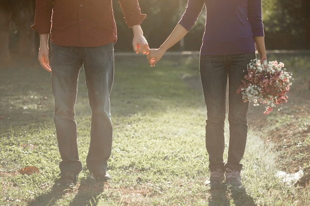 Free photo happy couple holding hands together as forever love.