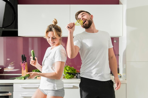 Free photo happy couple indoors having fun