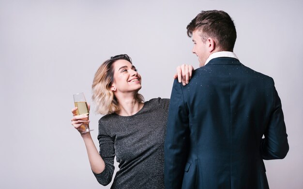 Happy couple looking at each other at party