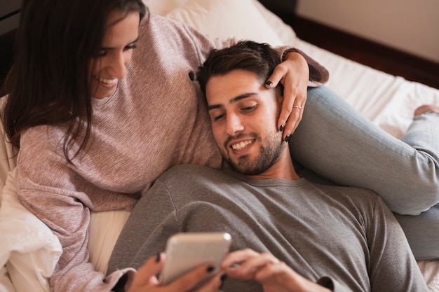 Happy couple looking at phone