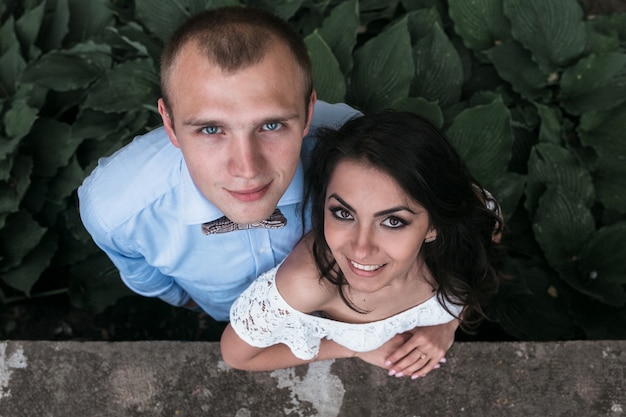 Free photo happy couple looking up