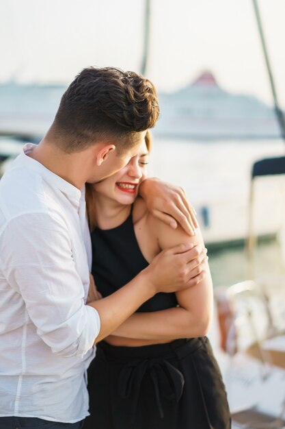 happy couple in love walks in the port