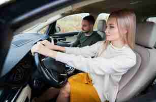 Free photo happy couple man and woman traveling in car