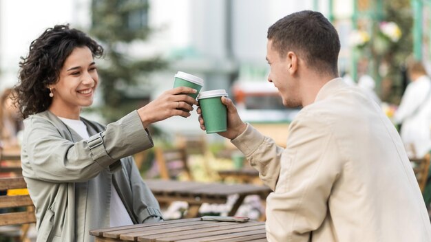 A happy couple outdoors near a cafe