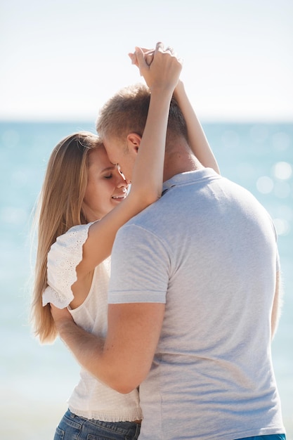 happy couple outdoors near the sea