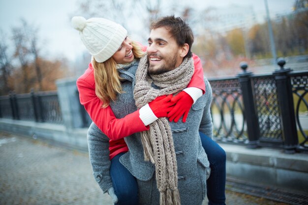 Happy couple piggybacking