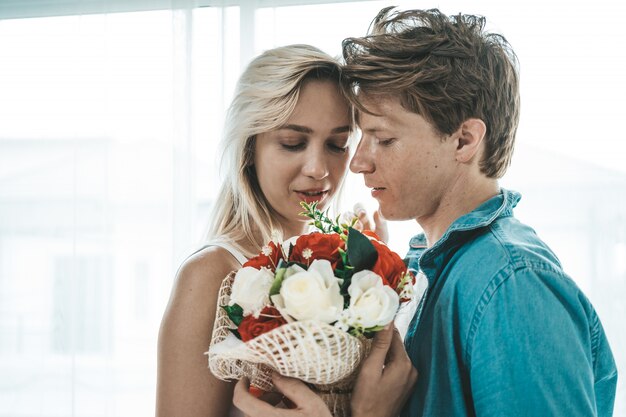 Happy Couple Playing together in the bedroom