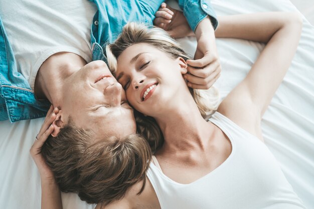 Happy Couple Playing together in the bedroom