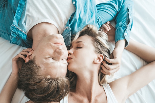 Happy Couple Playing together in the bedroom