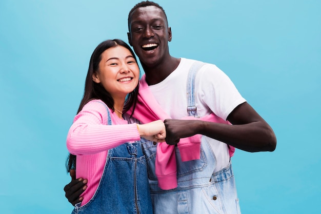 Free photo happy couple posing in studio