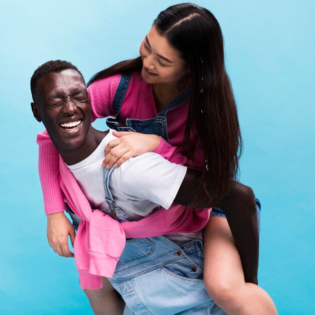 Happy couple posing in studio