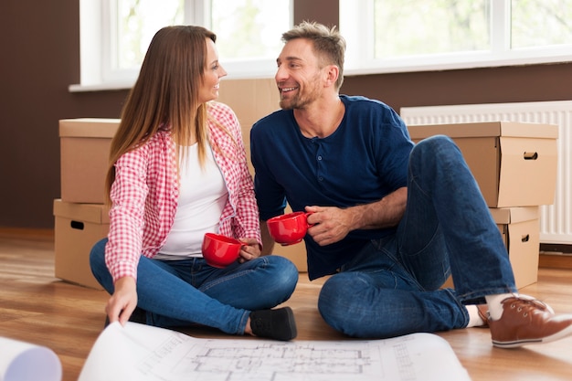 Happy couple relaxing in new home