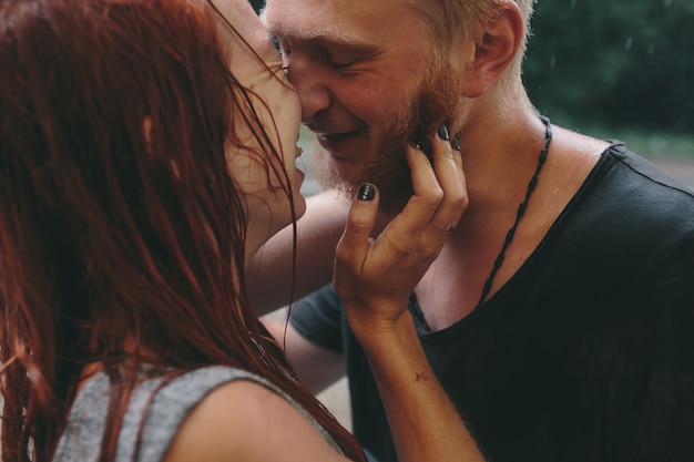 Happy couple in a romantic moment in the rain