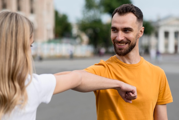 Happy couple stretching their arms